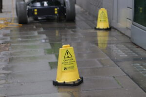 DOC Cleaning ground team caution sign 